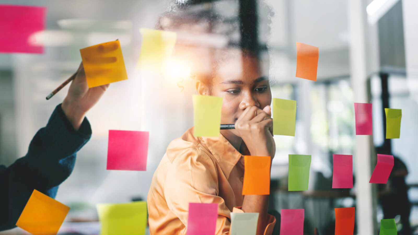 Young businesswoman creative team using sticky notes